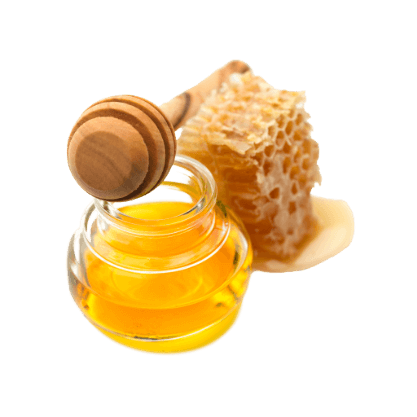 Kleines Glas Honig mit Hogilöffel und Honigwaben